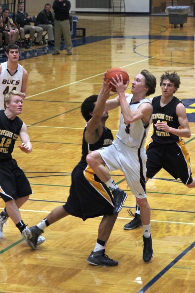 Senior Chad Mattson gets fouled on his way to the bucket, which  lead to  2 free throws. (Hewitt) 